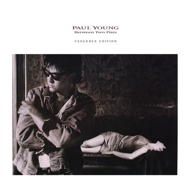PAUL YOUNG - Between Two Fires (Expanded Edition)